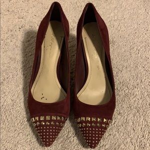 BCBG maroon heels with gold stud detailing on toe